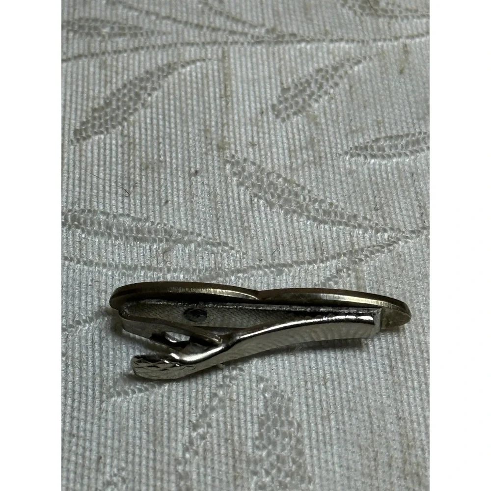 Vintage Anson tie clip featuring a crown‎ and sine wave